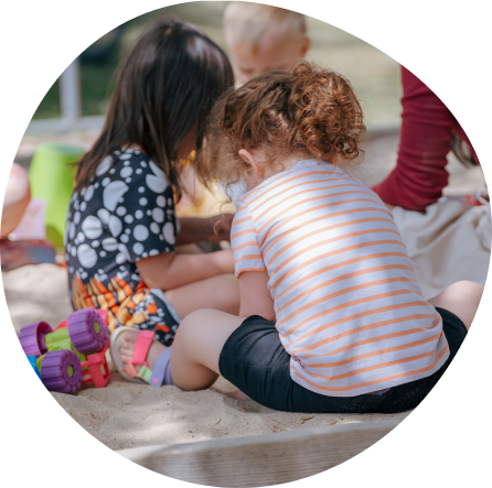 Children engage in creative play at Playful Scholars in Midland, blending fun with learning outdoors.