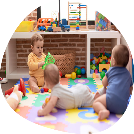 Infants playing with toys at Playful Scholars in Midland, MI, emphasizing safe and gentle learning.