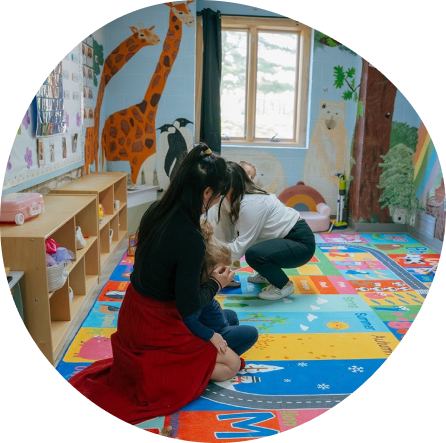Children engaged in play at Playful Scholars Midland, fostering creativity and learning in a colorful environment.