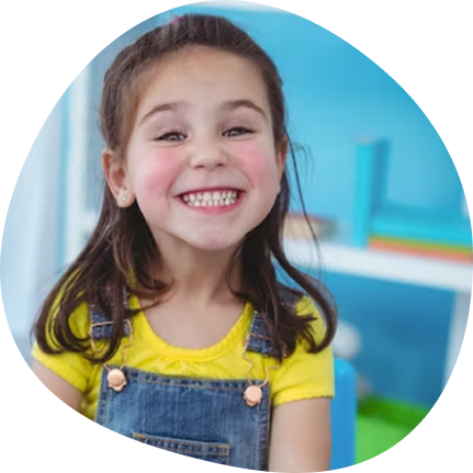 Happy child in a Pre-K class at Playful Scholars in Midland MI, inspired by play and creativity.