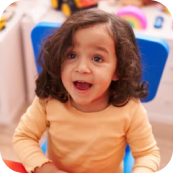 Happy child enjoying play-based learning at Playful Scholars preschool in Midland, MI.