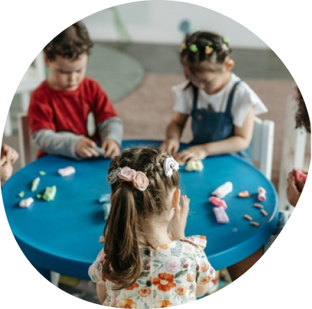 Preschool children playing and learning at Playful Scholars in Midland, MI, fostering creativity and joyful discovery.