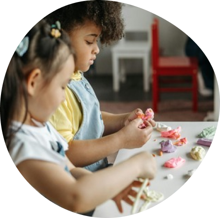 Toddlers engaging in creative play at Playful Scholars in Midland, MI, fostering curiosity and joyful learning.
